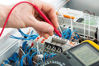 Emergency electrician inspecting electrical current