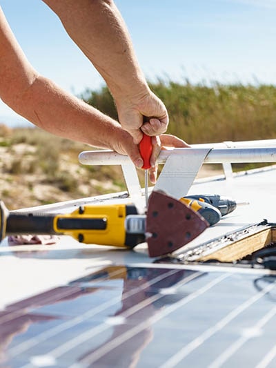 electrician repairing a solar panel